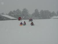 2005-03-15-Ruidoso-snowed-in-22-sledding-all-kids-at-once.JPG