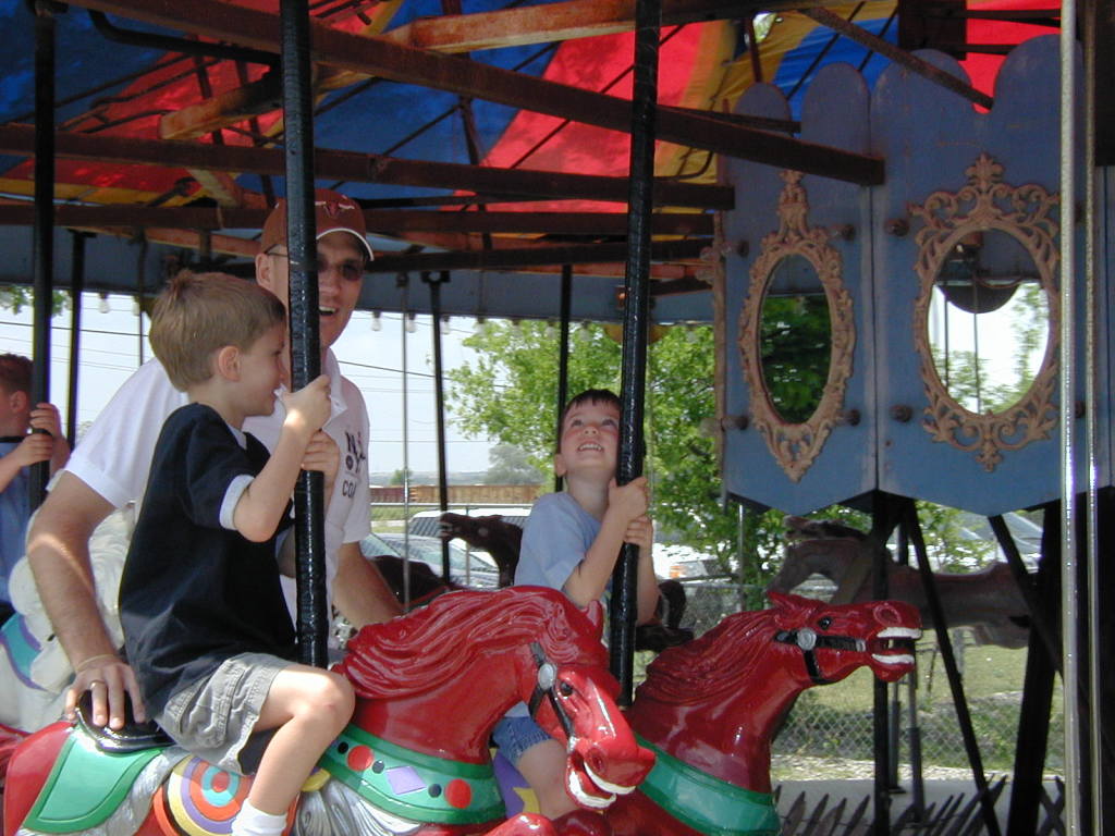 2005/04(April)/Zachary-soccer-party/1024x768_2005-04-16-Zachary-bday-Kiddie-Acres-10-Travis-Chance-Dax-merry-go-round.JPG