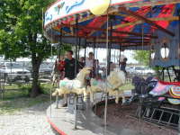 2005-04-16-Zachary-bday-Kiddie-Acres-12-Travis-Chance-Dax-merry-go-round.JPG