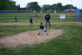 2005-05-09-T-ball-Chance-19-pitcher-blurry.JPG
