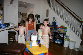 2005-05-13-cousins-over-02-making-icecream-Dax-Suzi-Kyla-Chance.JPG