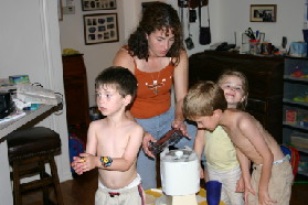 2005-05-13-cousins-over-03-making-icecream-Dax-Suzi-Kyla-Chance.JPG