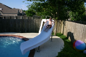 2005-05-30-Lasater-Dinner-pool-08-Chance-sliding.JPG