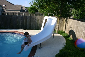 2005-05-30-Lasater-Dinner-pool-10-Chance-sliding.JPG