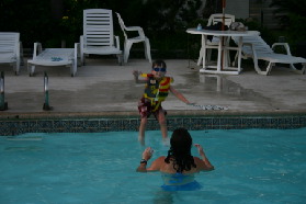 2005-07-02-Port-Aransas-70-pool-Dax-jumping-Suzi.jpg