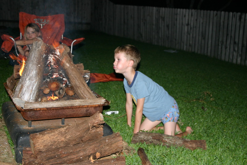 2005/08(August)/Camping-at-Justins/800x600_2005-08-06-Camping-at-Justins-house-18-Chance-blowing-fire.JPG