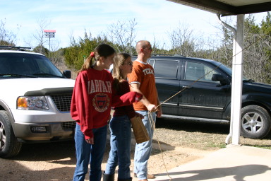 2006-02-04-Colton-bday-089-pinata-Courtney-Briana-Mike.JPG