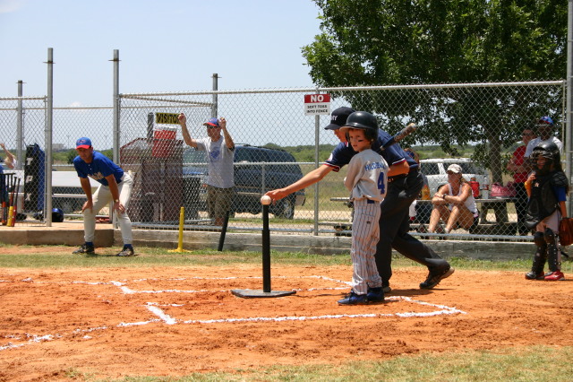 2006-06-17-Tball-AllStars-Bulldogs-Hays-CO-037-Chance-looking-at-coach.JPG