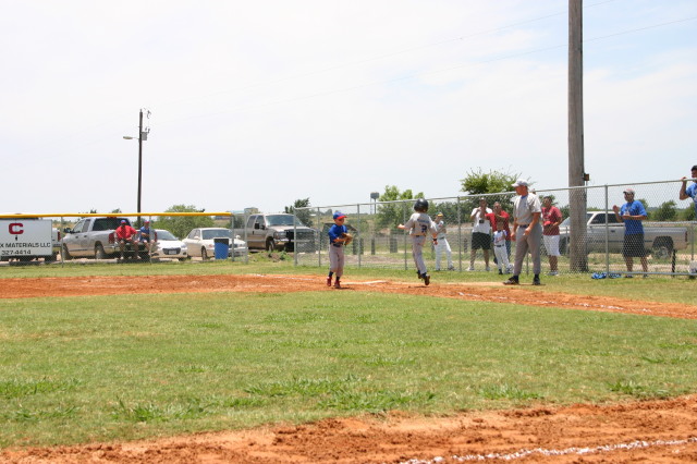 2006-06-17-Tball-AllStars-Bulldogs-Hays-CO-062-Logan-skips-to-1st.JPG