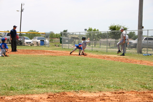 2006-06-17-Tball-AllStars-Bulldogs-Hays-CO-082-TylerWood-safe-at-1st.JPG