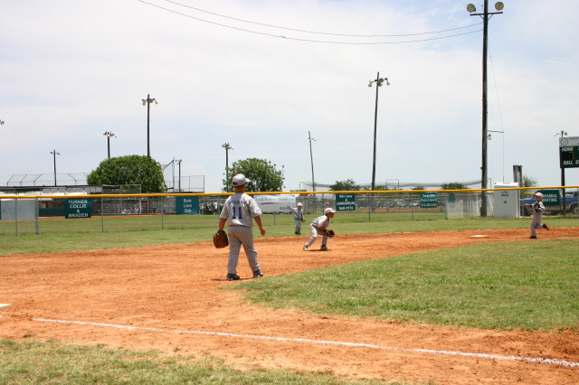 2006-06-17-Tball-AllStars-Bulldogs-Hays-CO-112-Seth-analyzes-with-ball.JPG