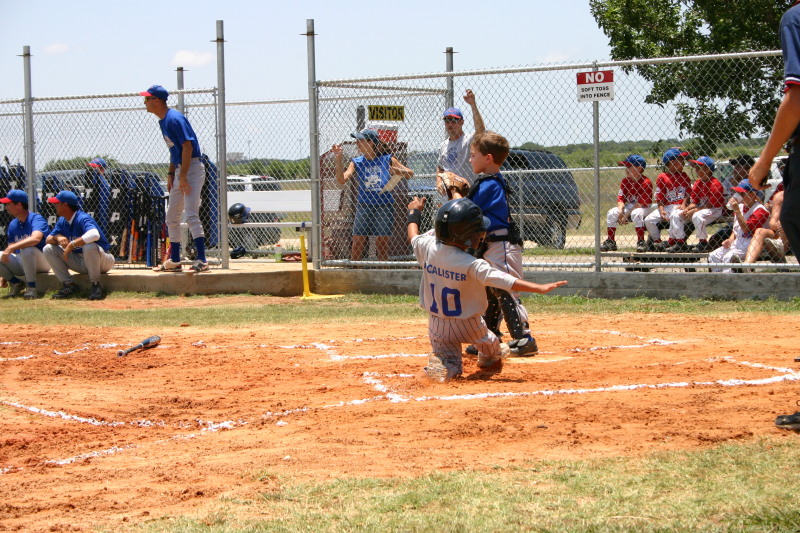 2006-06-17-Tball-AllStars-Bulldogs-Hays-CO-099-Seth-slides-home.JPG