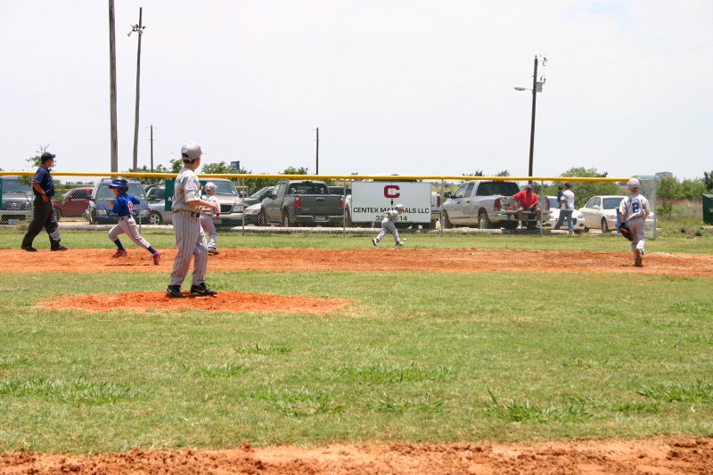 2006-06-17-Tball-AllStars-Bulldogs-Hays-CO-110-TylerWood-chases-ball.JPG