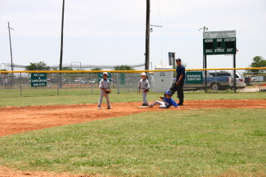 2006-06-17-Tball-AllStars-Bulldogs-Hays-CO-012-Seth-with-ball-at-2nd-Joseph.JPG