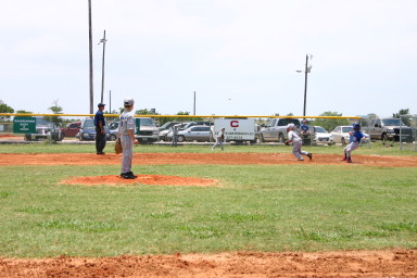 2006-06-17-Tball-AllStars-Bulldogs-Hays-CO-016-TylerWood-throws-it-in-from-Right.JPG