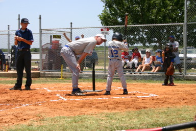2006-06-17-Tball-AllStars-Bulldogs-Hays-CO-060-Brad-talks-to-Logan-at-bat.JPG