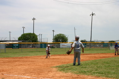 2006-06-17-Tball-AllStars-Bulldogs-Hays-CO-107-Seth-fields-the-ball.JPG