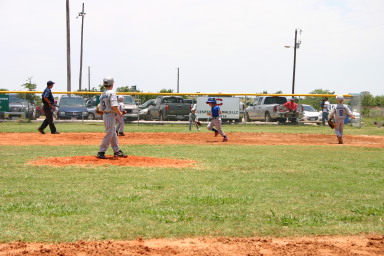 2006-06-17-Tball-AllStars-Bulldogs-Hays-CO-109-Tyler-Wood-fields-ball.JPG