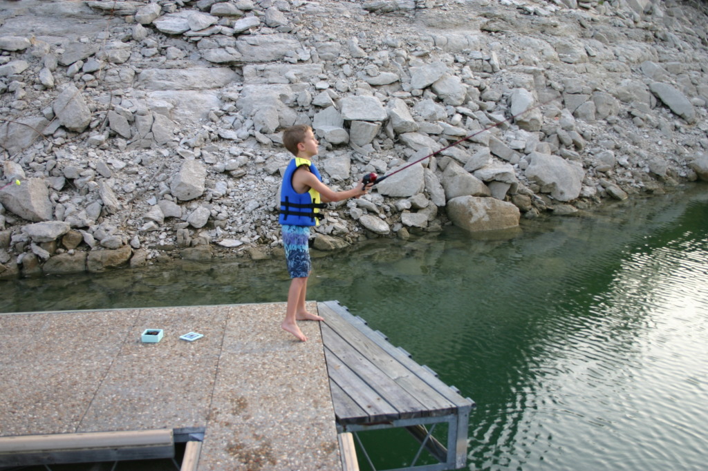 2006-07-22-Justin-sailboat-23-fishing-Chance.JPG