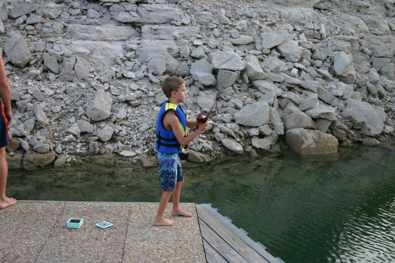 2006-07-22-Justin-sailboat-20-fishing-Chance.JPG