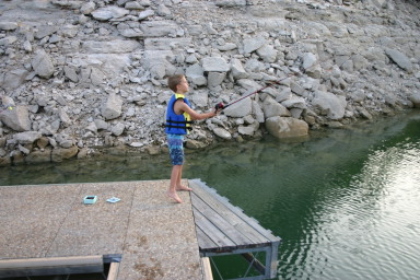 2006-07-22-Justin-sailboat-23-fishing-Chance.JPG