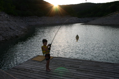 2006-07-22-Justin-sailboat-24-fishing-Dax.JPG