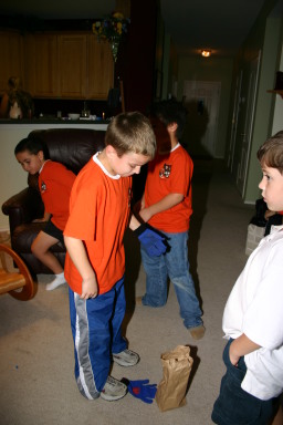 2006-11-14-TigerScouts-Den1-17-glove-gum-game.JPG