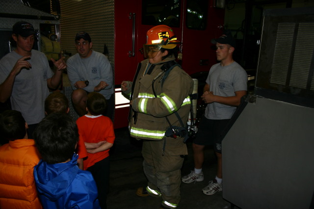 2006-11-21-TigerScouts-firehouse-22-Gina-equipment.JPG