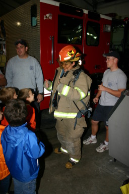 2006-11-21-TigerScouts-firehouse-21-Gina-equipment.JPG