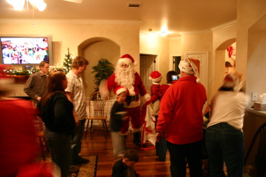 2006-12-24-Christmas-Eve-80-Santa-Justin-Katie-Justin-Chance-Dax-Ian-Heather-Jim-Suzi.JPG