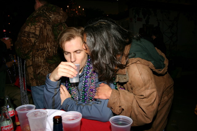 2007-02-15-New-Orleans-Balcony-20-Ben-cigar-headache-Kavita.JPG