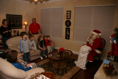 2007-12-24-Christmas-Eve-04-Santa-Janeen-Jim-Dax-Chance-Vale-Katie-Ian-Heather.JPG