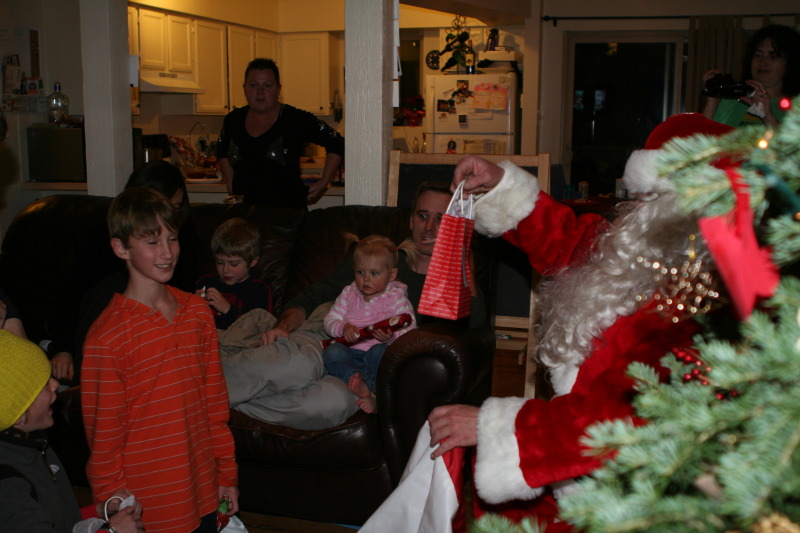 2009-12-24-Christmas-Colorado-08-Santa-Chance-Ian-Katie.JPG