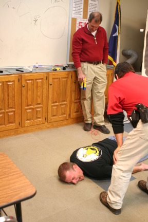 2010-01-12-ITOC-R1-TeamLead-015-Travis-gets-tazed.JPG