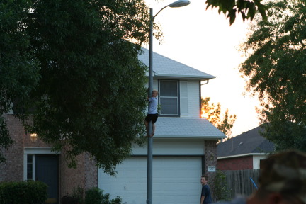 2010-05-28-Hanging-out-14-JC-climbing-pole.JPG