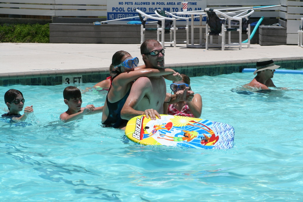 2010-07-05-Port-Aransas-039-Travis-Chance-Dax-pool-wrestling-kids.JPG