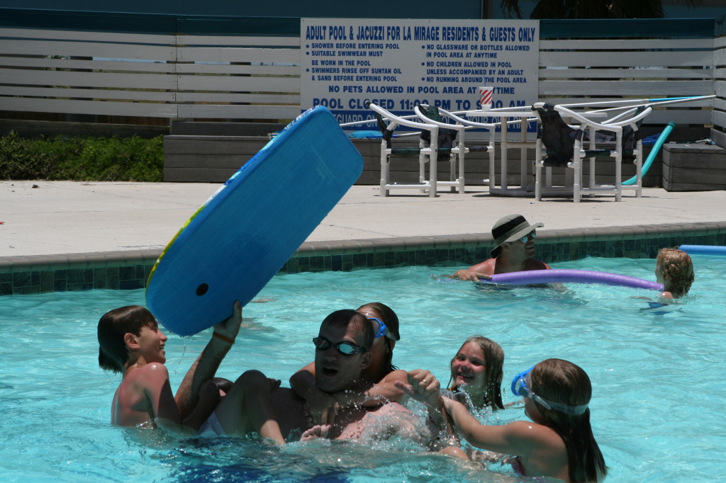 2010-07-05-Port-Aransas-056-Travis-Chance-Dax-pool-wrestling-kids.JPG