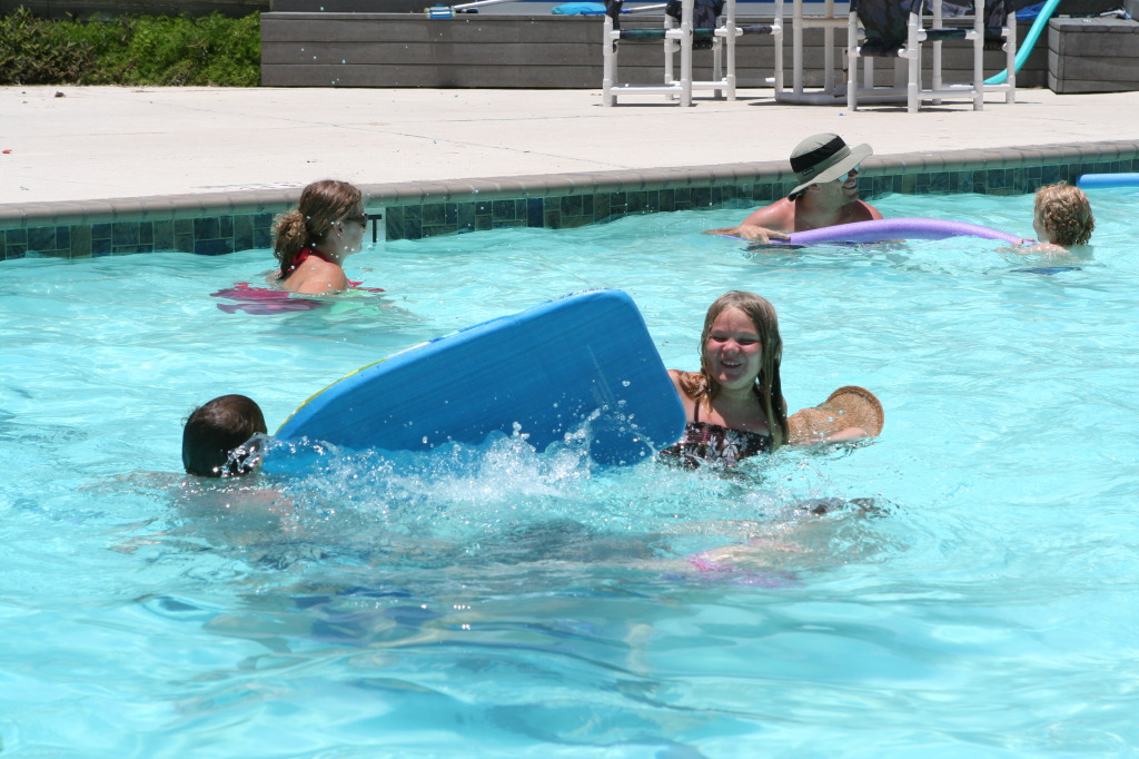 2010-07-05-Port-Aransas-057-Travis-Chance-Dax-pool-wrestling-kids.JPG