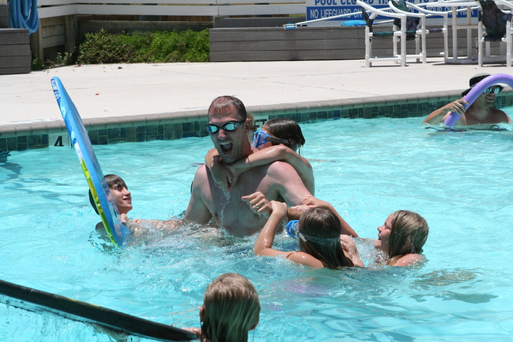 2010-07-05-Port-Aransas-060-Travis-Chance-Dax-pool-wrestling-kids.JPG