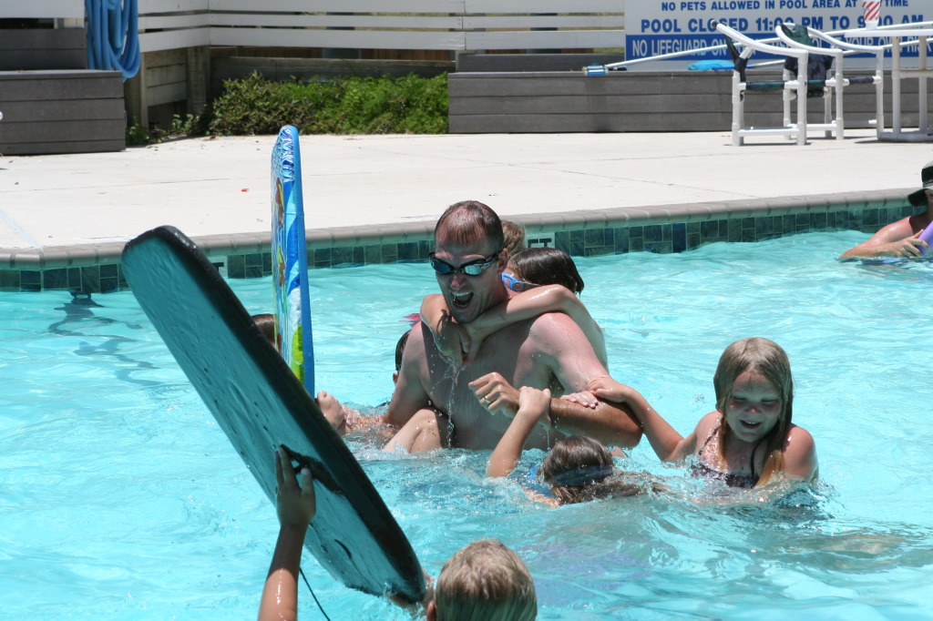 2010-07-05-Port-Aransas-061-Travis-Chance-Dax-pool-wrestling-kids.JPG