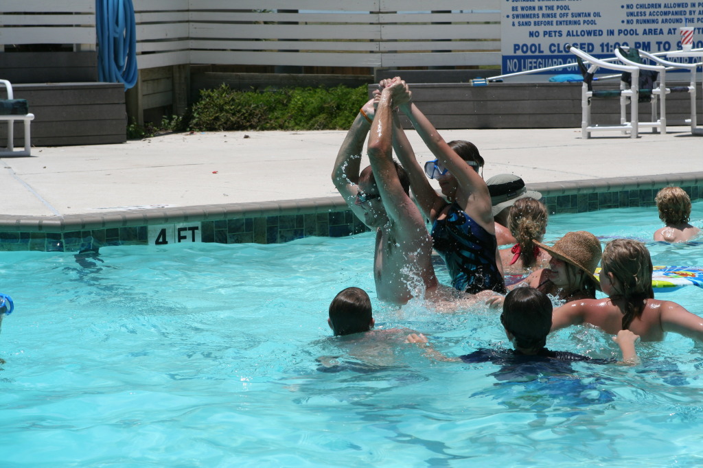2010-07-05-Port-Aransas-066-Travis-Chance-Dax-pool-wrestling-kids.JPG