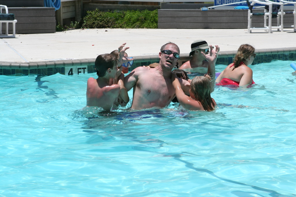 2010-07-05-Port-Aransas-086-Travis-Chance-Dax-pool-wrestling-kids.JPG