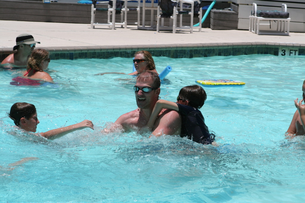 2010-07-05-Port-Aransas-093-Travis-Chance-Dax-pool-wrestling-kids.JPG