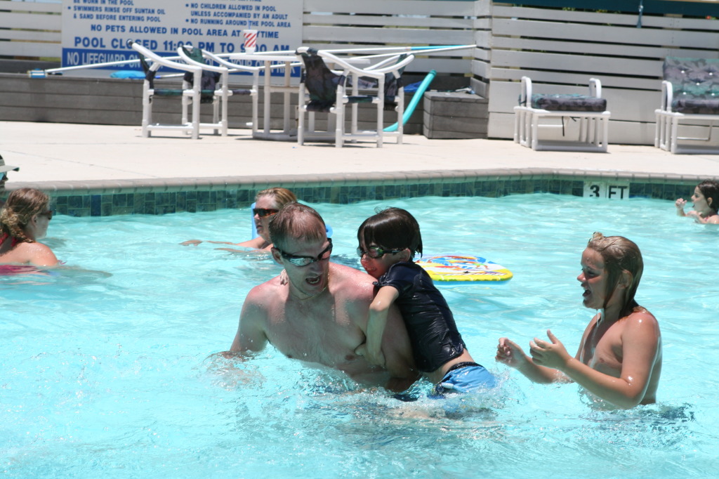 2010-07-05-Port-Aransas-095-Travis-Chance-Dax-pool-wrestling-kids.JPG