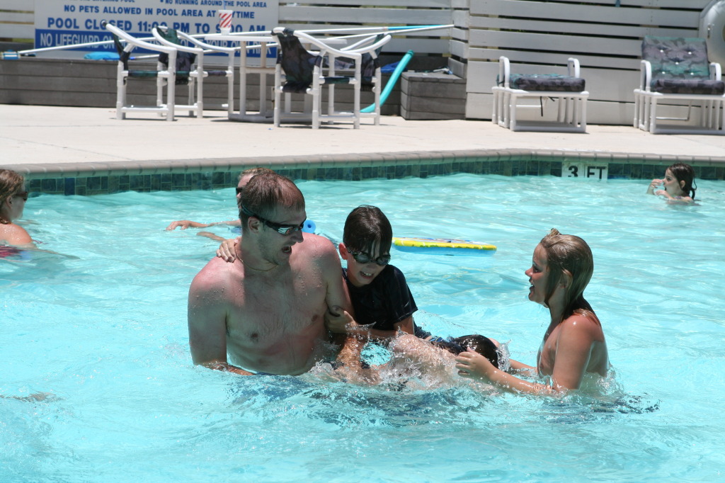 2010-07-05-Port-Aransas-096-Travis-Chance-Dax-pool-wrestling-kids.JPG