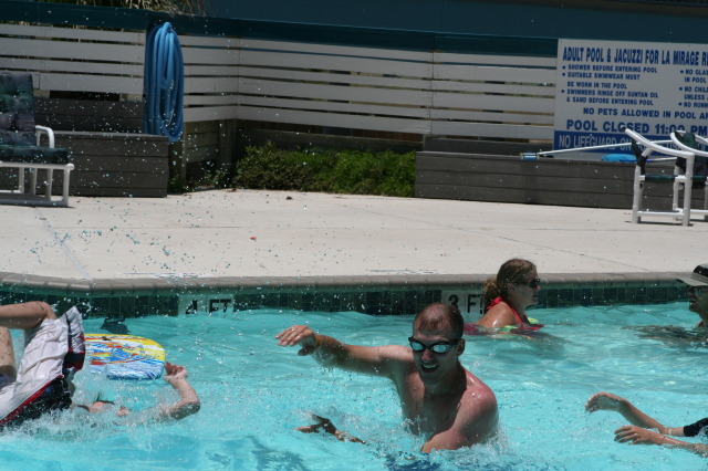 2010-07-05-Port-Aransas-026-Travis-Chance-Dax-pool-wrestling-kids.JPG