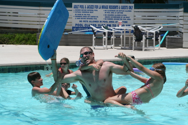 2010-07-05-Port-Aransas-046-Travis-Chance-Dax-pool-wrestling-kids.JPG