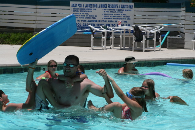 2010-07-05-Port-Aransas-051-Travis-Chance-Dax-pool-wrestling-kids.JPG