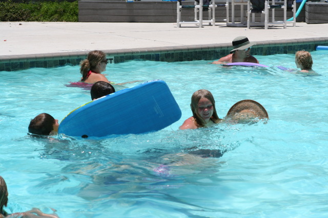 2010-07-05-Port-Aransas-058-Travis-Chance-Dax-pool-wrestling-kids.JPG