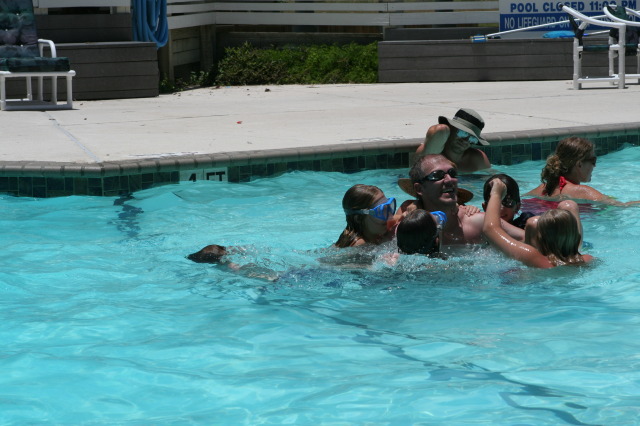 2010-07-05-Port-Aransas-073-Travis-Chance-Dax-pool-wrestling-kids.JPG